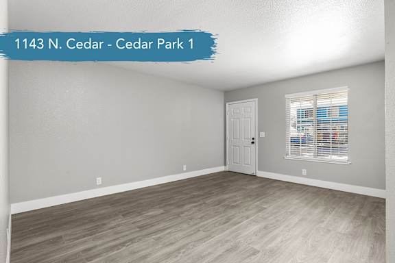 A room with a door and a window at 1143 N. Cedar - Cedar Park 1.