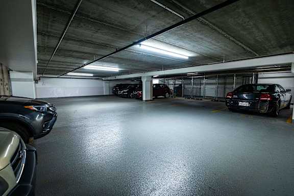 a parking garage with cars parked in it
