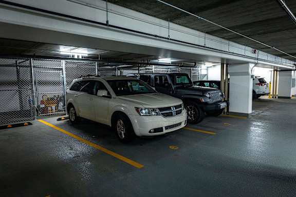 a parking garage with cars parked in it