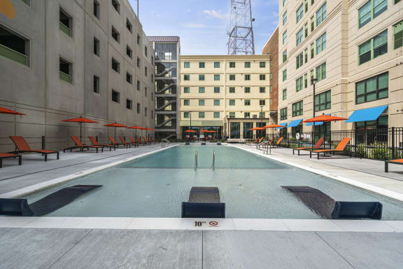 a swimming pool in the middle of two buildings