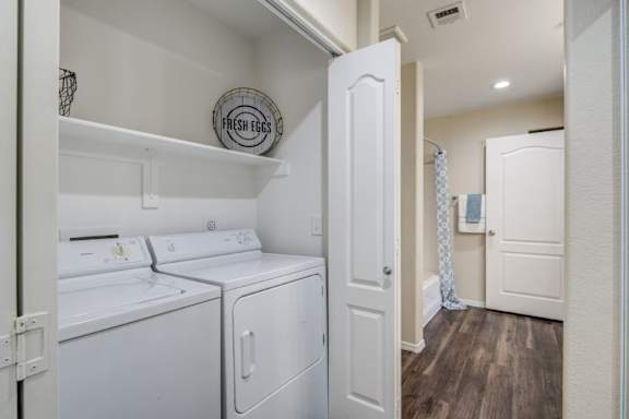 A laundry room with a washer and dryer.
