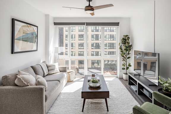 Living Room With TV at Anthem House Apartments, Huntsville, AL 35806