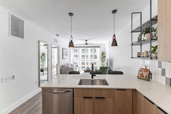 Dishwasher and wooden cabinets at Anthem House Apartments, Huntsville, 35806