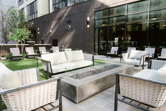 Patio with firepit and white chairs at Anthem House, Huntsville, AL
