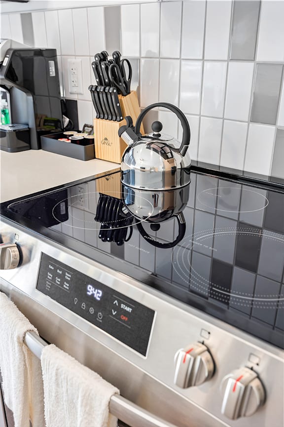 A tea kettle is on a stove at Anthem House Apartments, Alabama 35806