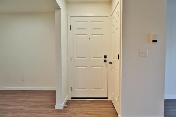 Floor Plan  A white door is in a white room.