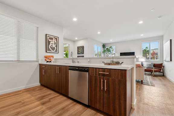 Modern kitchen in The Park apartments with gorgeous wood soft-close cabinetry
