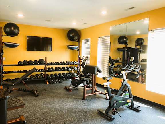 fitness center, weights, bike at 1400 Russell Apartments, Missouri