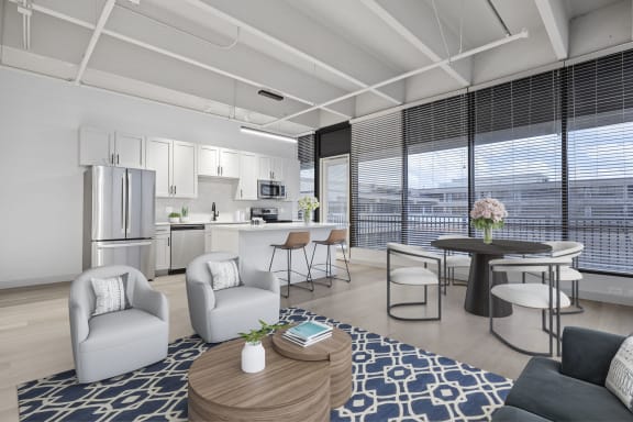 an open floor plan with a kitchen and living room at The Residences at Tesson Ridge, Missouri