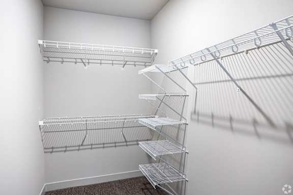 Empty shelves in a white room.