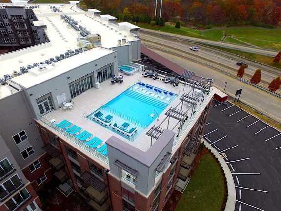 A swimming pool on the roof of a building.