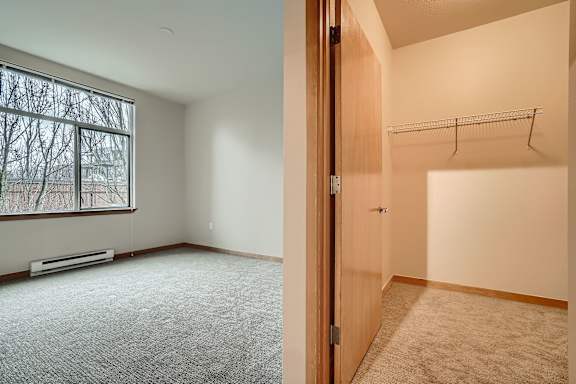 A room with a window and a door.