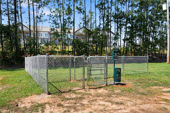 the gate into the dog park at the apartments for rent