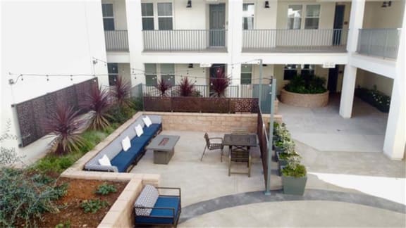 a patio with a table and chairs in front of a building at Arrive Los Carneros II, California, 93117