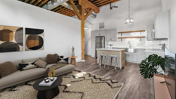 Living Room and Kitchen with Counter and Stools at FreightYard Townhomes and Flats, Minneapolis, 55401