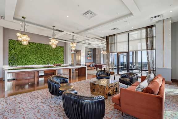 community with a bar and couches and chairs