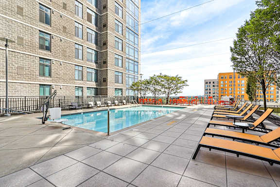 a large pool and lounge chairs