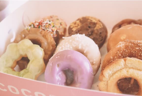 Assorted donuts in bakery box at Brooklyn Yard Apartments, Oregon, 97202