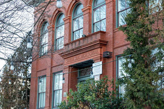 a large brick building with a sign in front of it at Residences at South High, Pittsburgh, 15203 ?