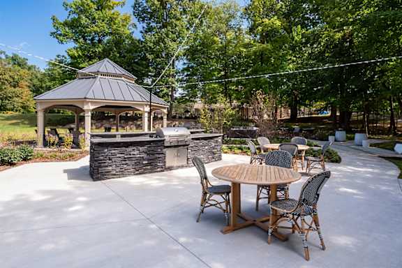 a patio with a gazebo and a table with chairs  at Ascent at Farmington Hills, Michigan