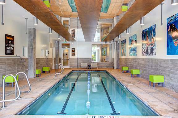 Large indoor swimming pool with a wooden ceiling at Track 29 Apartments, Minneapolis, MN, Minnesota