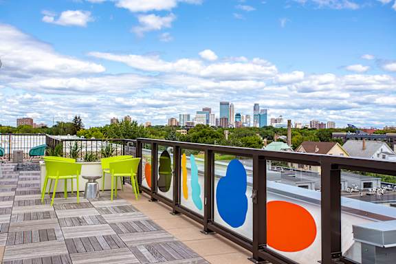 Patio with a view of the city skyline at Track 29 Apartments, Minneapolis, 55408