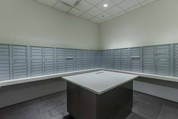 an empty room with lockers and a table in the middle