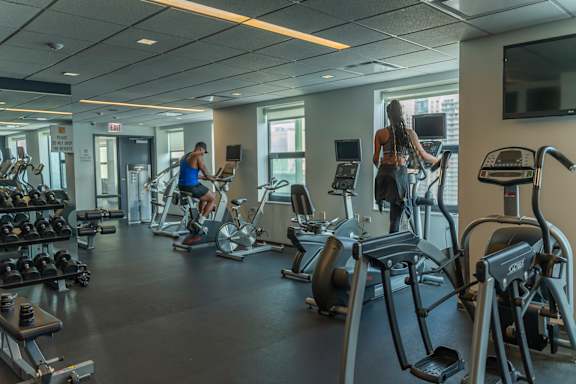 a group of people working out in a gym