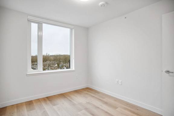 A room with a window and a door.