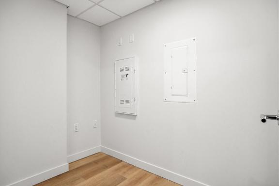 A white door with a white frame is on the right side of the image.