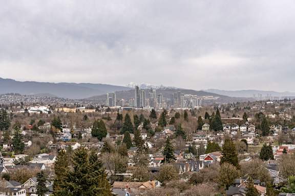 A cityscape with a bridge in the background.