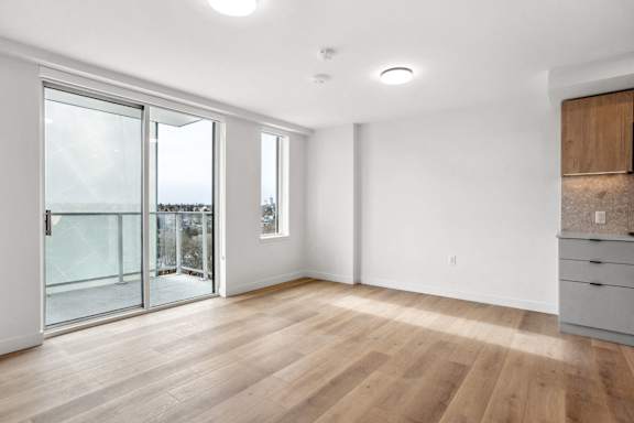 A room with wooden floors and white walls.