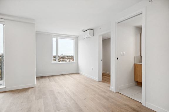 A room with a window and a door.