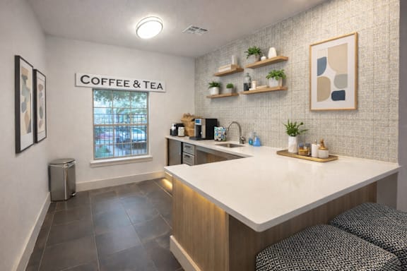 A coffee and tea shop interior with a counter and shelves.