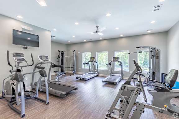 A spacious gym with a variety of exercise equipment.
