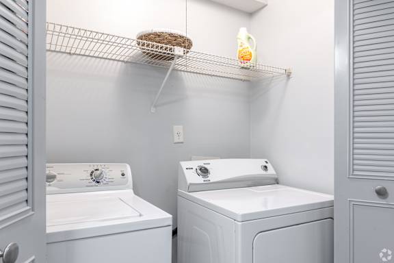 A laundry room with a washer and dryer.
