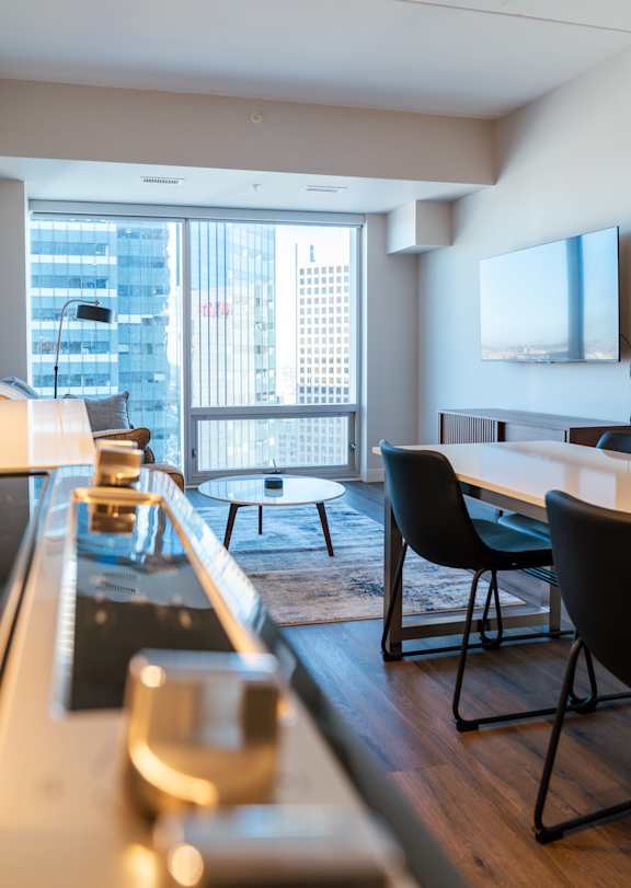A modern kitchen with a view of the city.