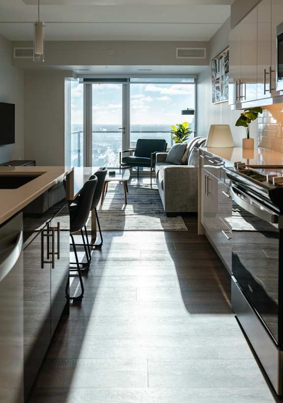 A modern kitchen with a view of the city.