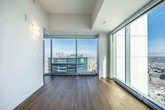 A room with a view of the cityscape.