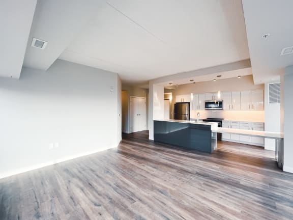 a kitchen and dining area in a 555 waverly unit