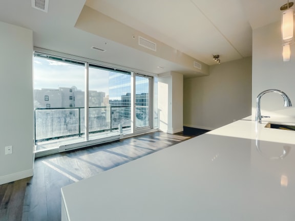 a kitchen with a large window and a view of the city