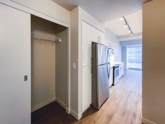 a kitchen and living room in a 555 waverly unit