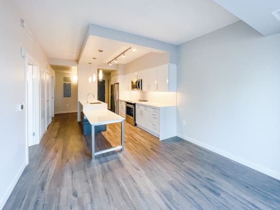 a kitchen and dining area in a 555 waverly unit