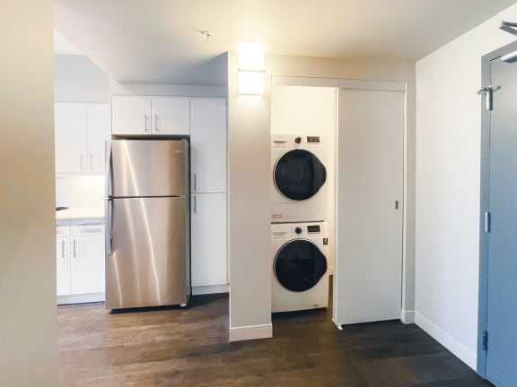 a small laundry room with a washer and dryer