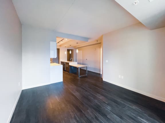 a view of the living room and kitchen in a 555 waverly unit