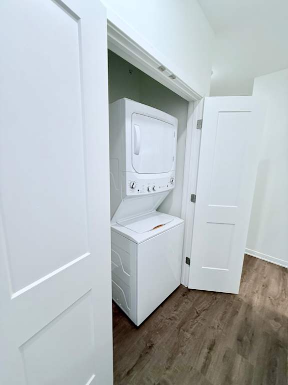 A white washing machine is in a small room.
