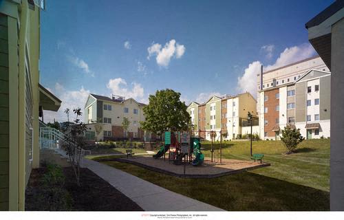 a playground in the middle of an apartment building