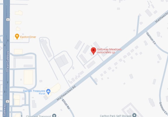 a map showing the location of a gas station with a red dot on it