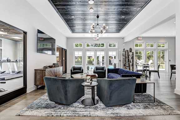 A modern living room with a black and white color scheme.