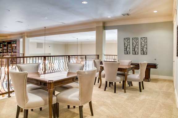 Dining room with large table and chairs at The Laurel at Vintage Park 55+ Apartments, Texas